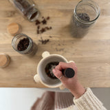 Handmade ceramic mortar and pestle inspired by ancient stone kitchen tools