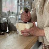 Handmade ceramic mortar and pestle inspired by ancient stone kitchen tools