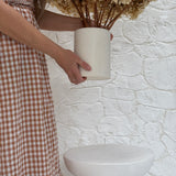 Handmade ceramic canister vase for kitchen utensils or flowers in a neutral finish