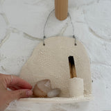 Handmade ceramic wall shelf altar for displaying crystals, candles, or palo santo.