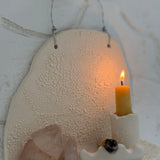 Handmade ceramic wall shelf altar for displaying crystals, candles, or palo santo.