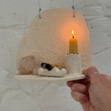 Handmade ceramic wall shelf altar for displaying crystals, candles, or palo santo.