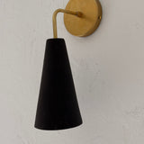Handmade conical ceramic wall sconce in a neutral finish