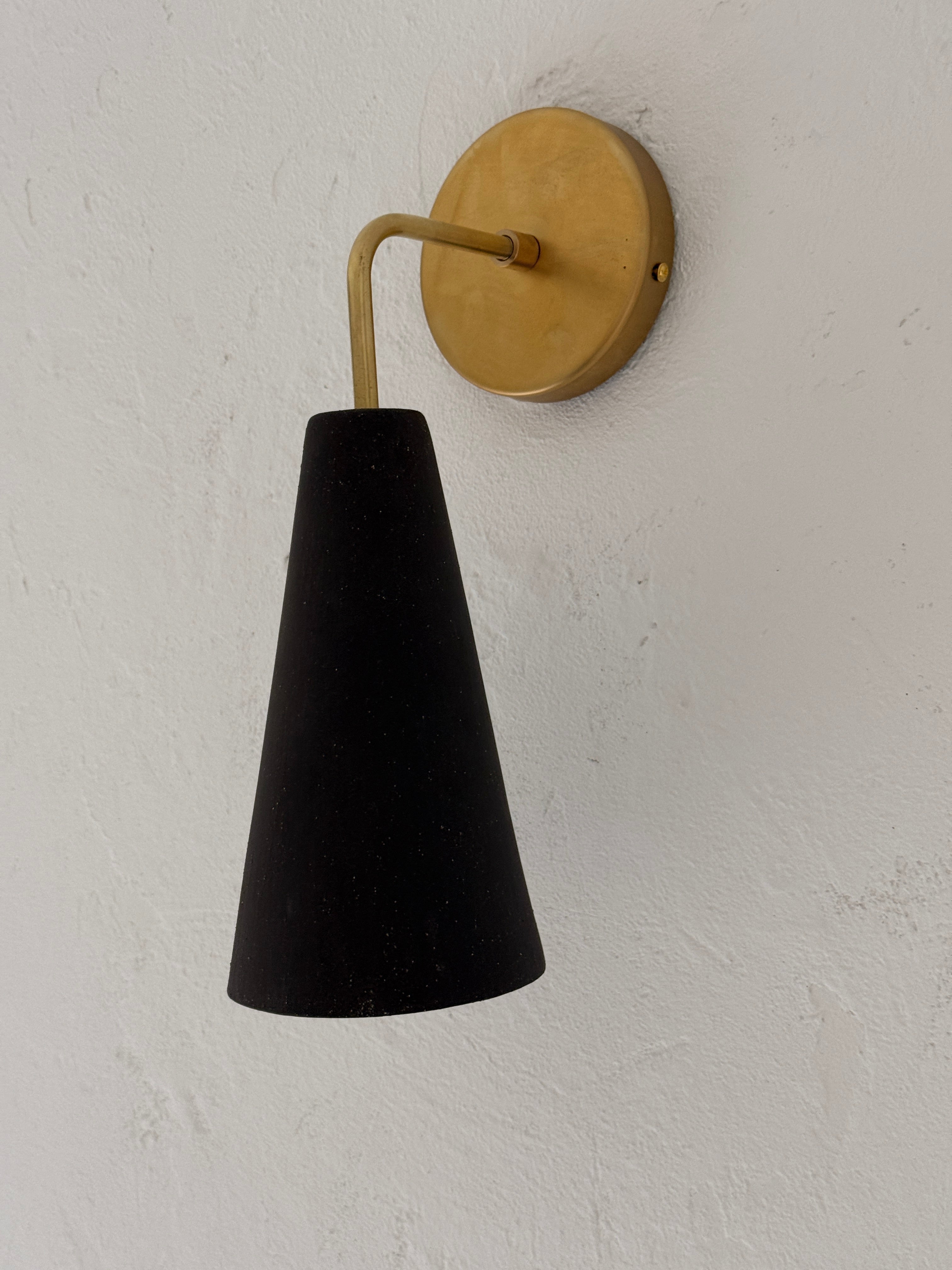 Handmade conical ceramic wall sconce in a neutral finish