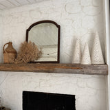 Handmade stoneware tree luminary with star cutouts glowing from an LED tea light