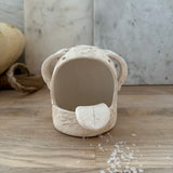 Whimsical handmade ceramic salt cellar shaped like Stanley, a googly-eyed monster
