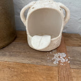 Whimsical handmade ceramic salt cellar shaped like Stanley, a googly-eyed monster