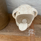 Whimsical handmade ceramic salt cellar shaped like Stanley, a googly-eyed monster