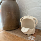 Whimsical handmade ceramic salt cellar shaped like Stanley, a googly-eyed monster