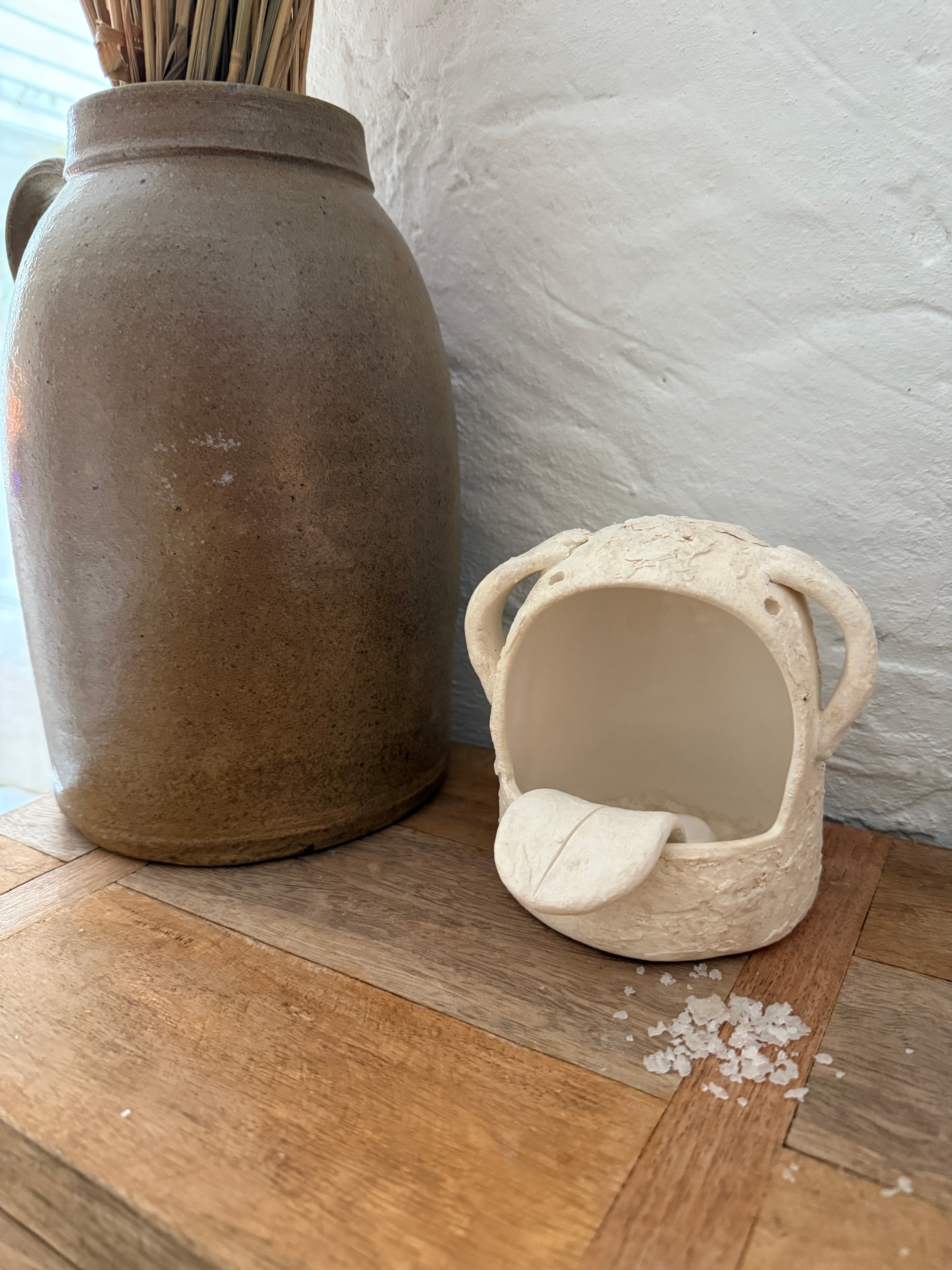 Whimsical handmade ceramic salt cellar shaped like Stanley, a googly-eyed monster