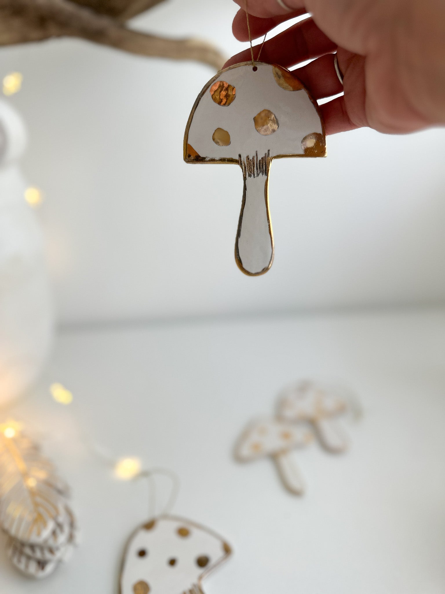 Handmade porcelain mushroom ornaments with 22K gold luster by Muddy Heart