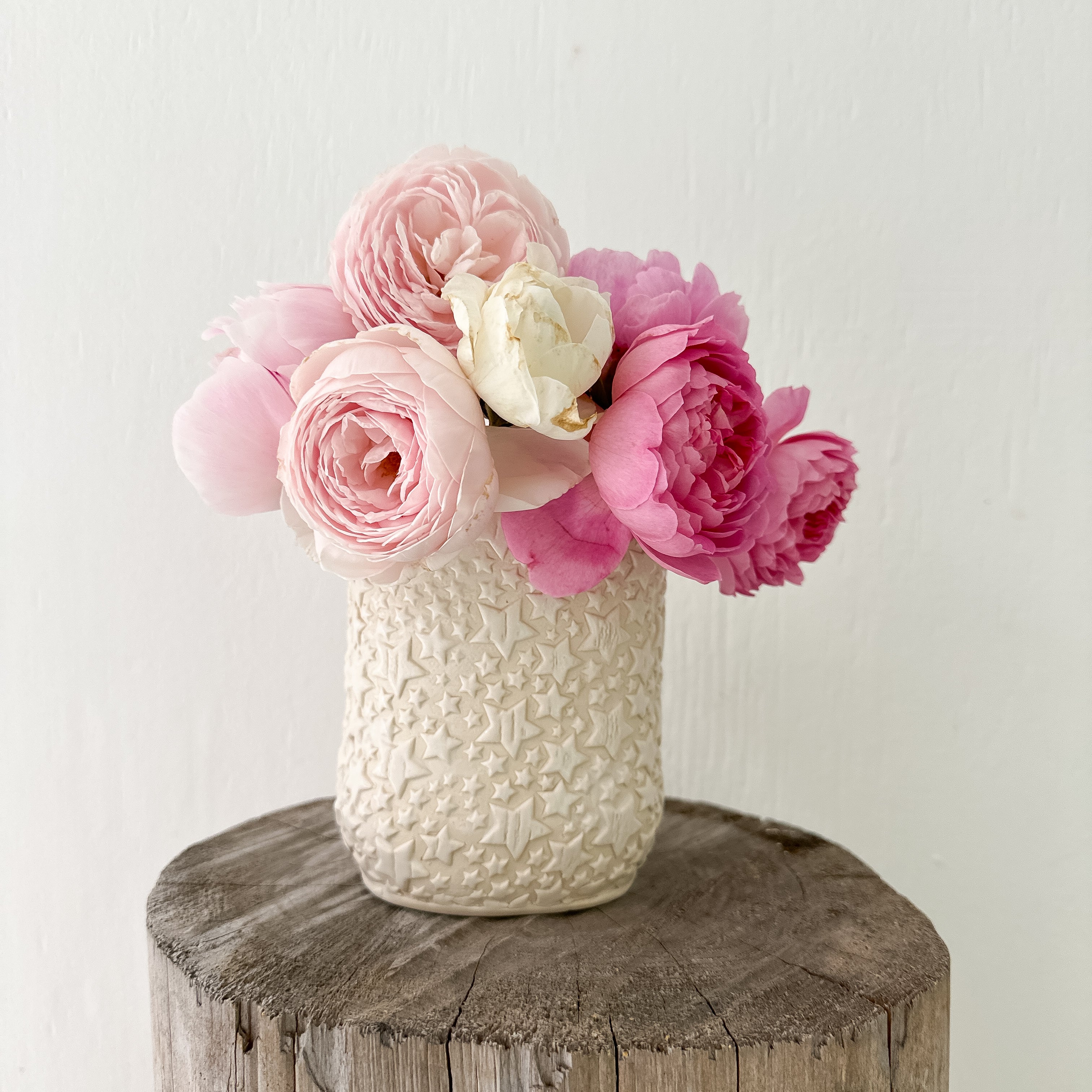 Star-textured ceramic vase for flowers or stylish storage