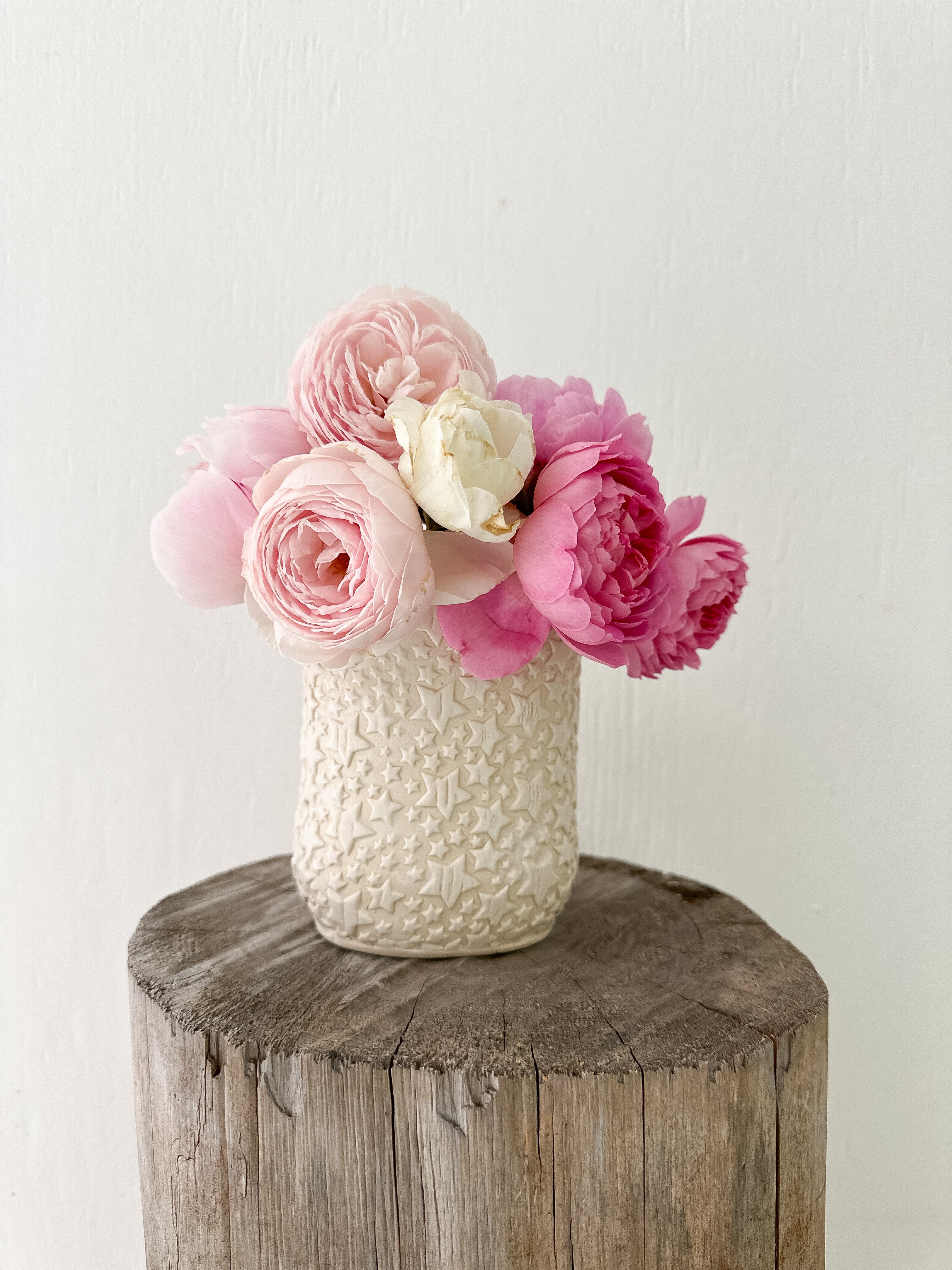 Star-textured ceramic vase for flowers or stylish storage