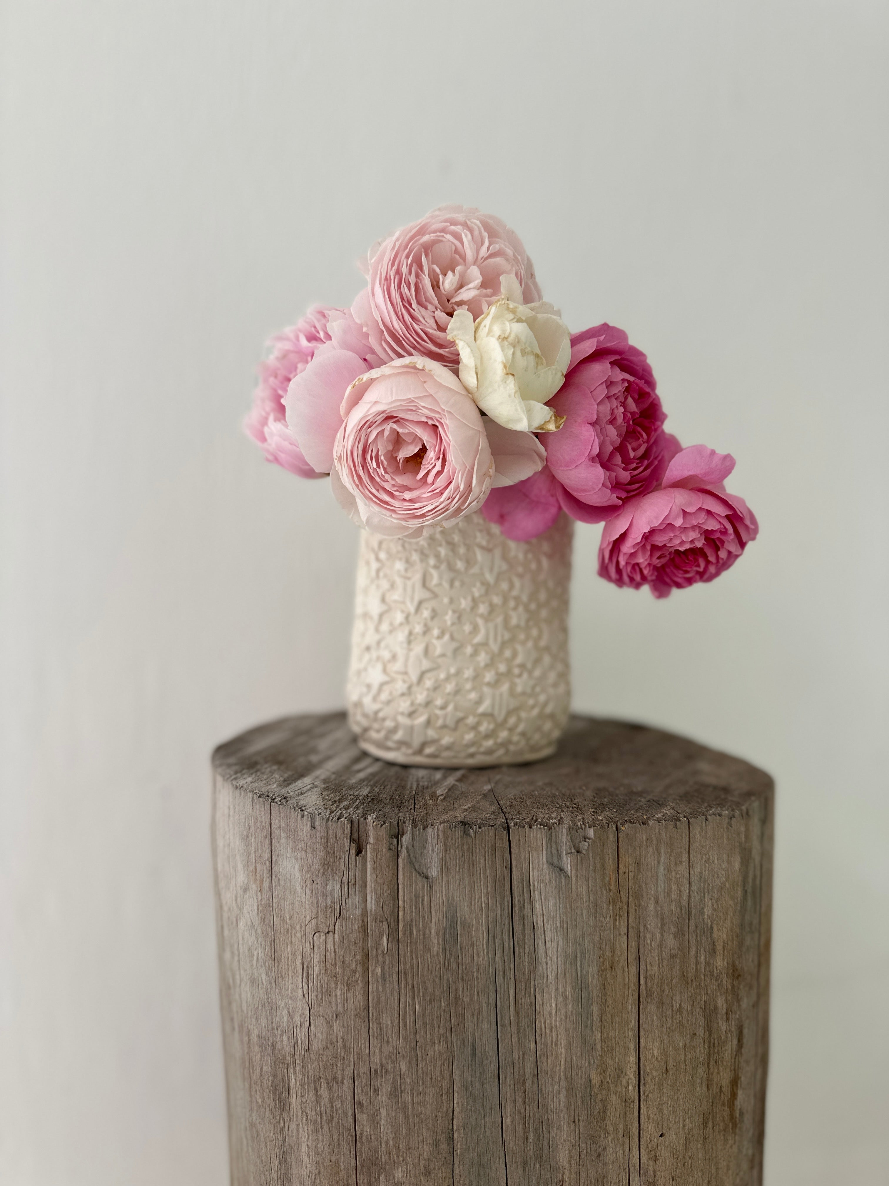 Star-textured ceramic vase, shown in a neutral tone