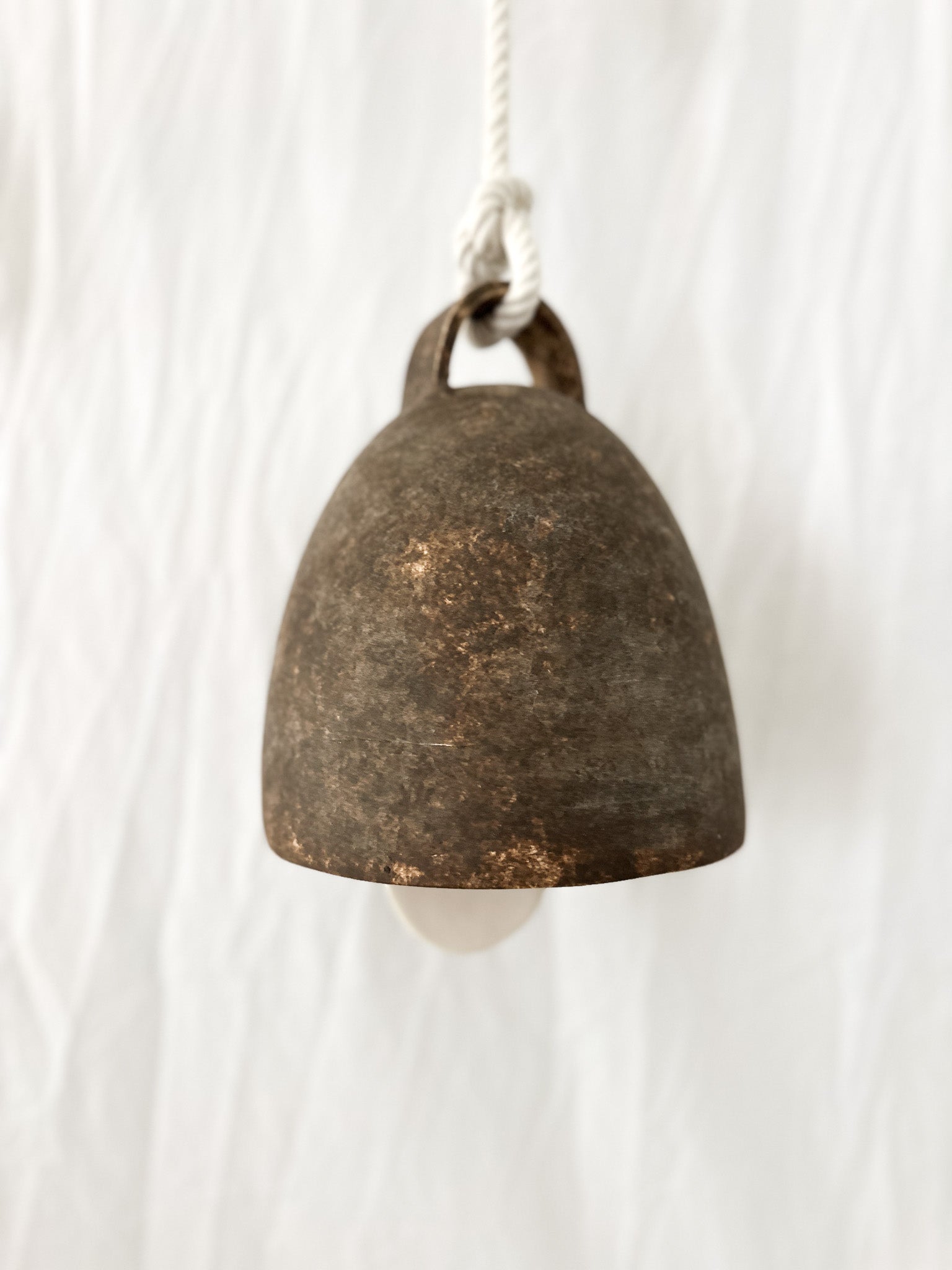 Large campana ceramic bell shown for scale