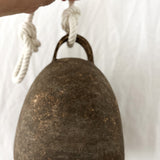 Substantial ceramic bell with a rounded campana shape, side view
