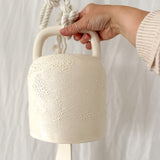 Textured white ceramic barrel bell, handcrafted with a soft, calming chime