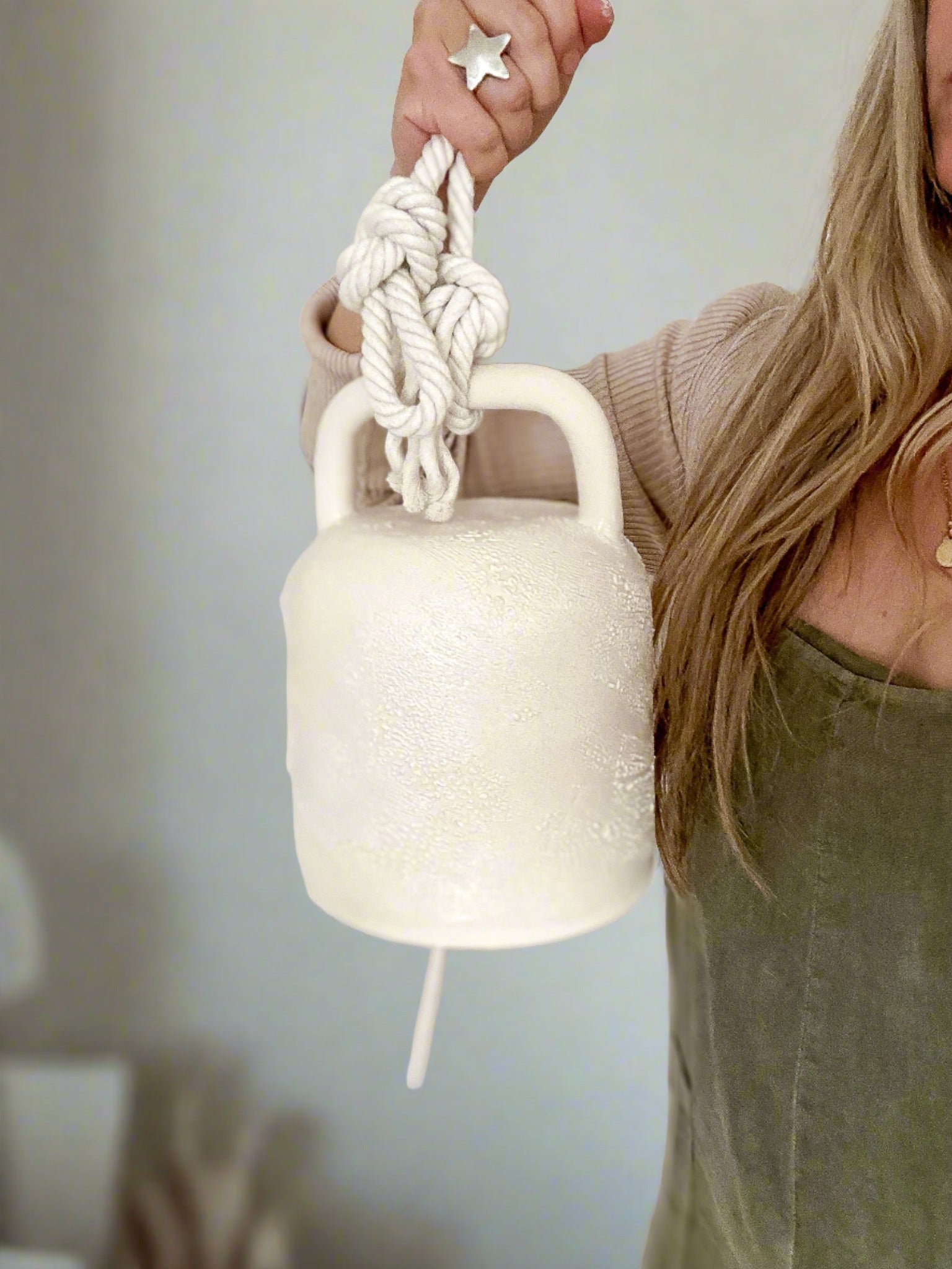 Textured white ceramic barrel bell with rope, for boho and farmhouse interiors