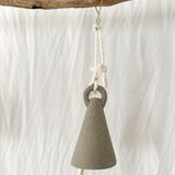 Handmade ceramic spire bell with a tall triangular silhouette in a neutral glaze