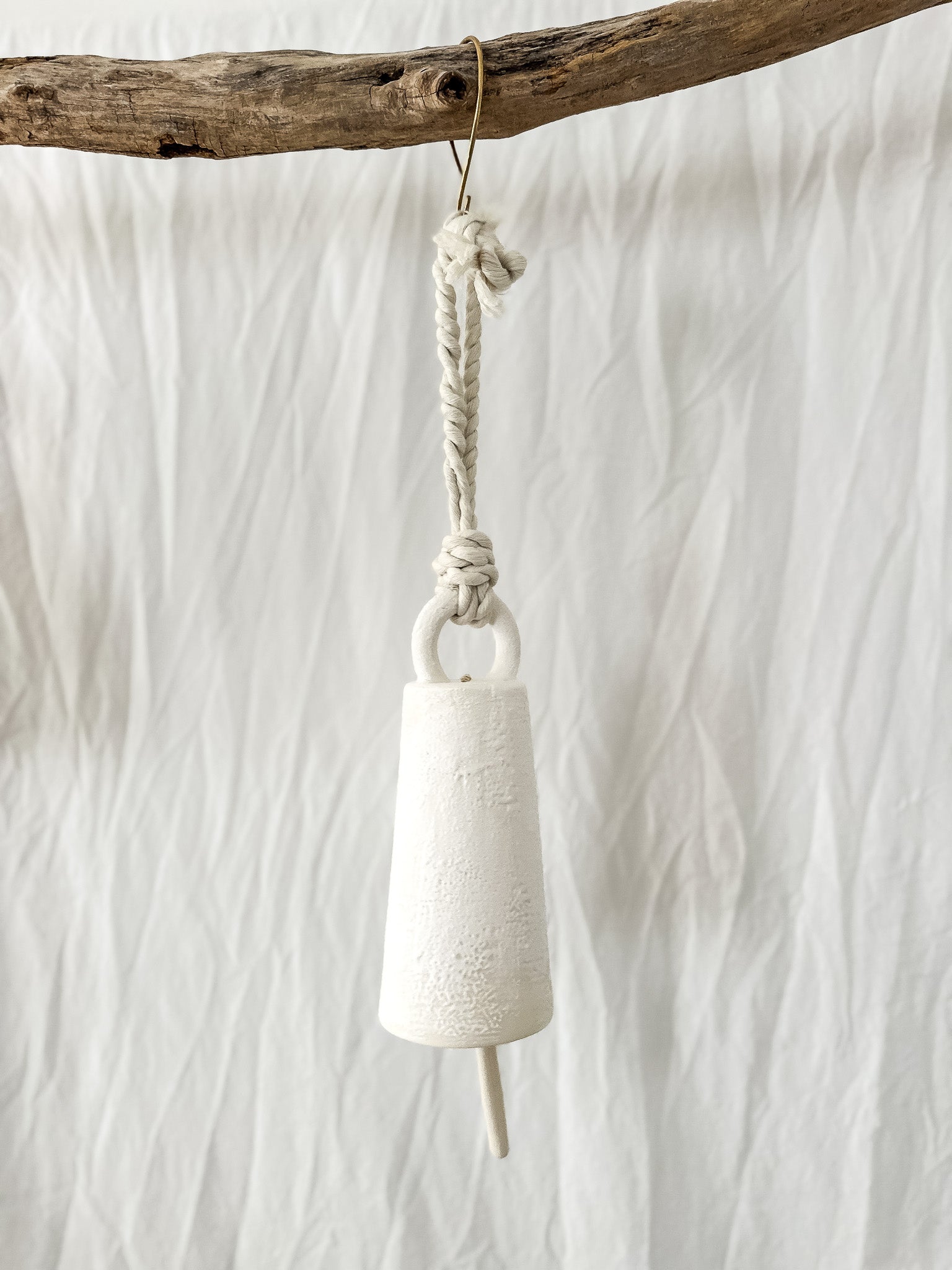 Handmade neutral-glaze ceramic spotlight bell, detail of the finish