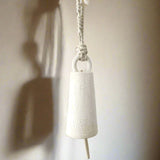 Spotlight-shaped ceramic bell, side view