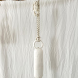 Close-up of the glaze on a handmade long round-handle ceramic bell
