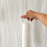 Ceramic wall bell with a rounded handle, side view