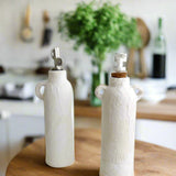 Ceramic pump dispenser bottle in a neutral glaze for kitchen or bath