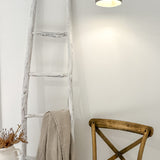 Neutral ceramic barrel pendant light shown lit