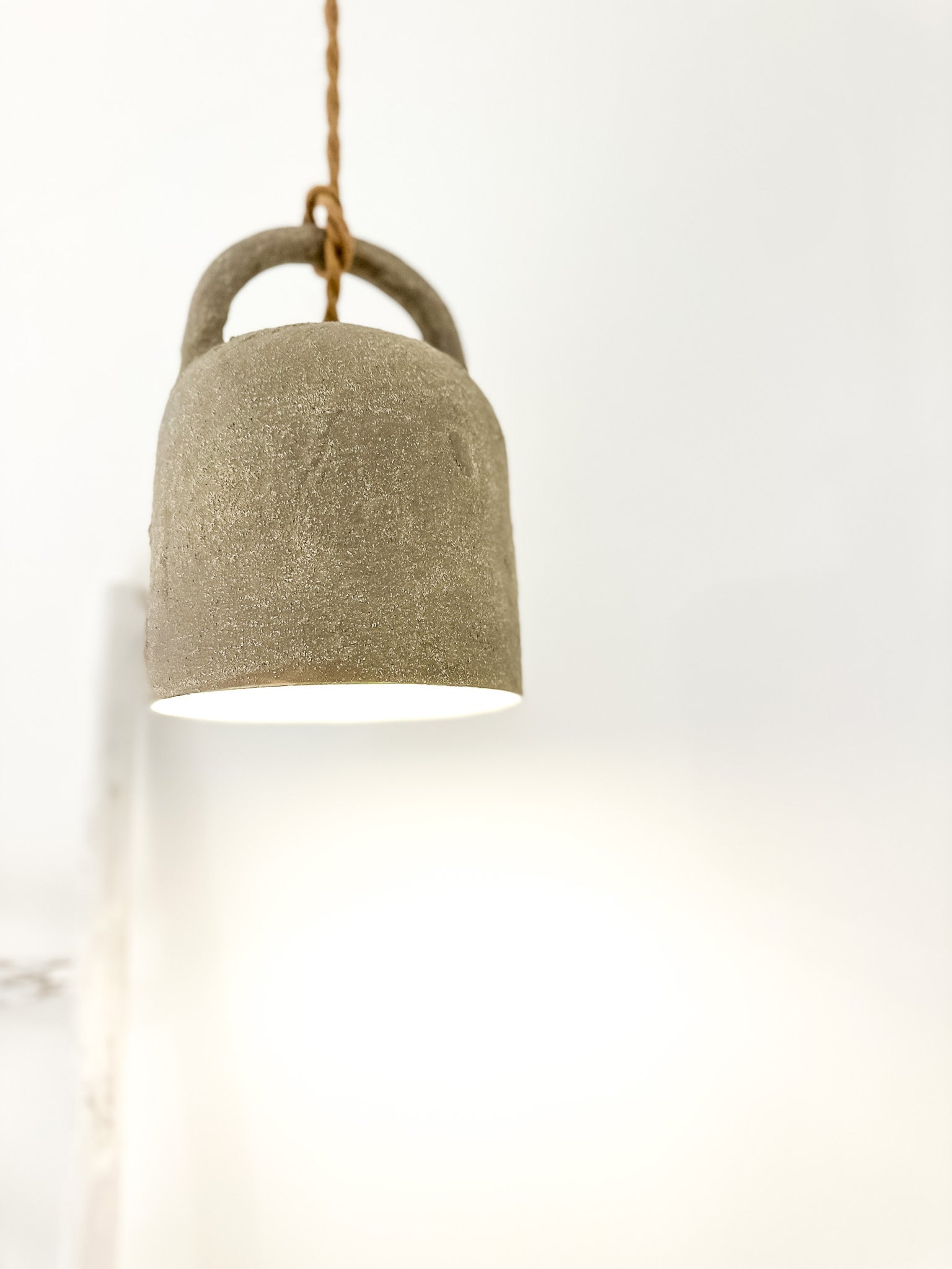 Handmade ceramic barrel pendant light, close-up view