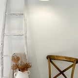 Handmade barrel pendant lamp styled over a dining table