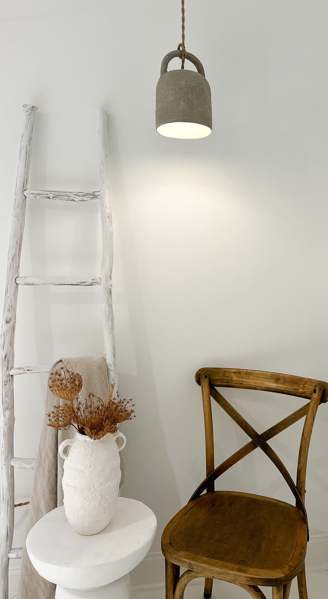 Handmade barrel pendant lamp styled over a dining table