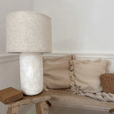 Handmade ceramic bedside lamp with silver hardware and cloth wiring