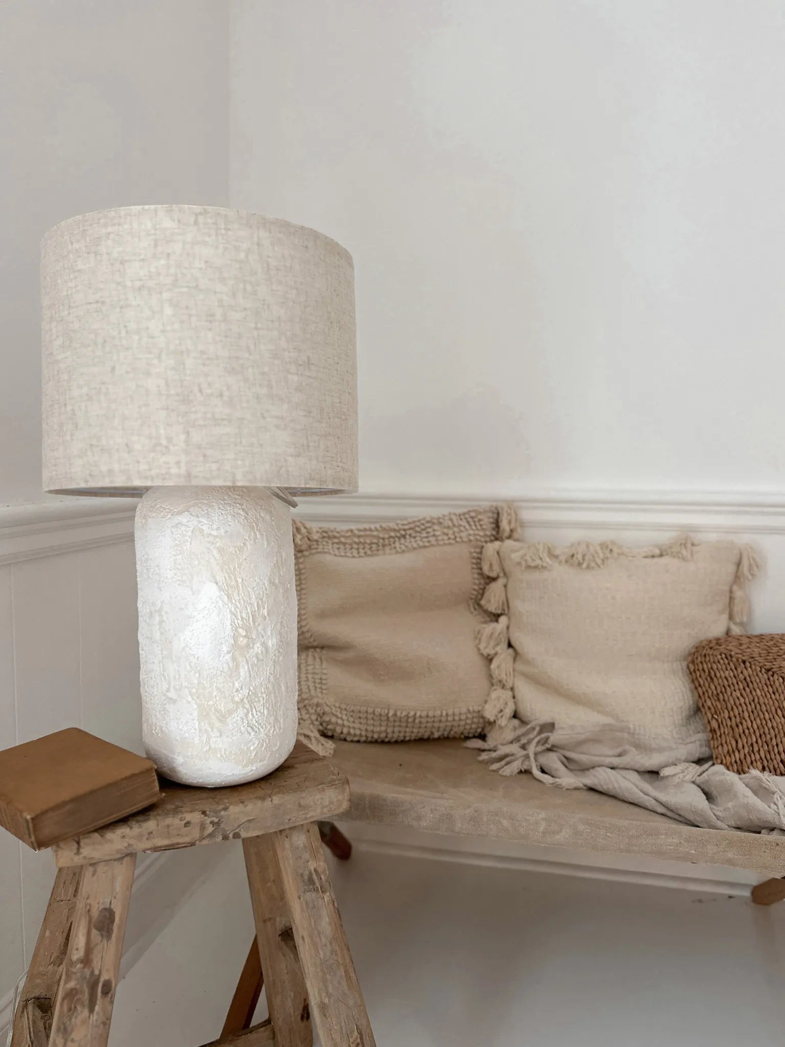 Handmade ceramic bedside lamp with silver hardware and cloth wiring