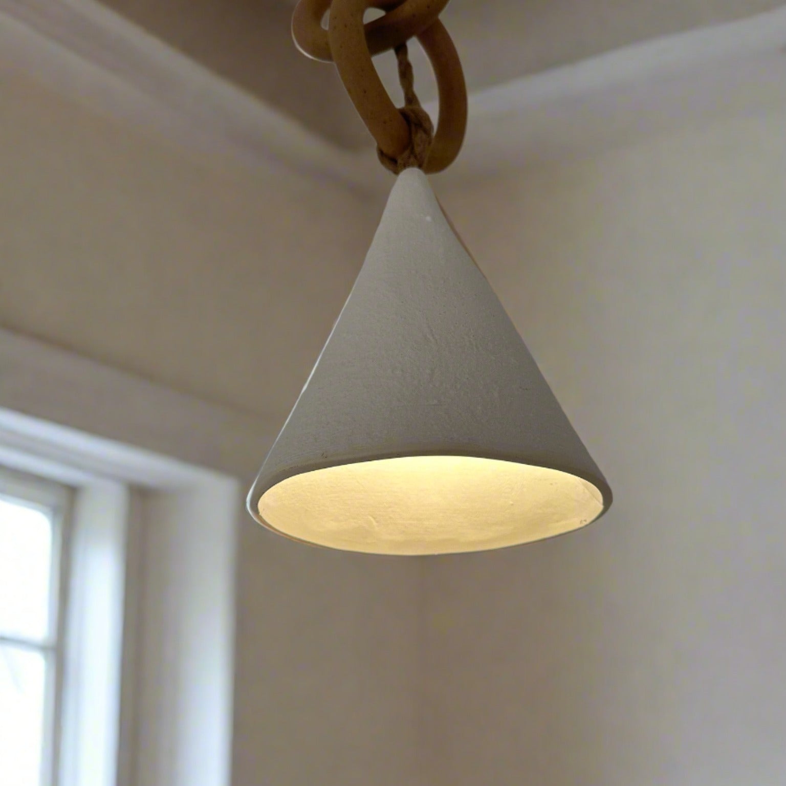Handmade ceramic loops pendant light with a sculptural silhouette
