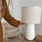 Sculptural rounded ceramic table lamp in a neutral glaze