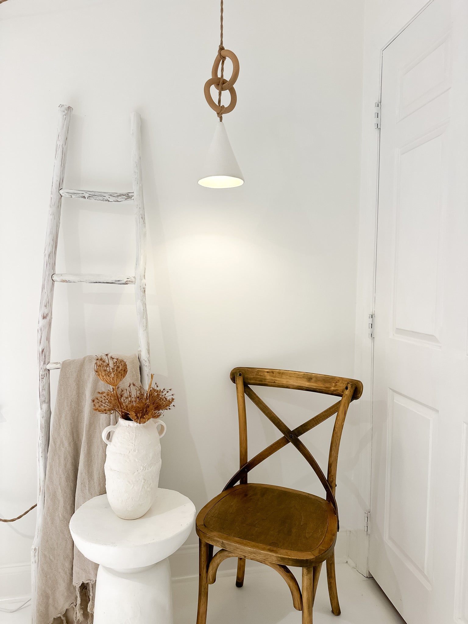 Neutral-glaze ceramic loops pendant lamp shown lit