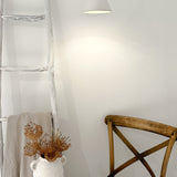Loops pendant light hanging from a fabric cord