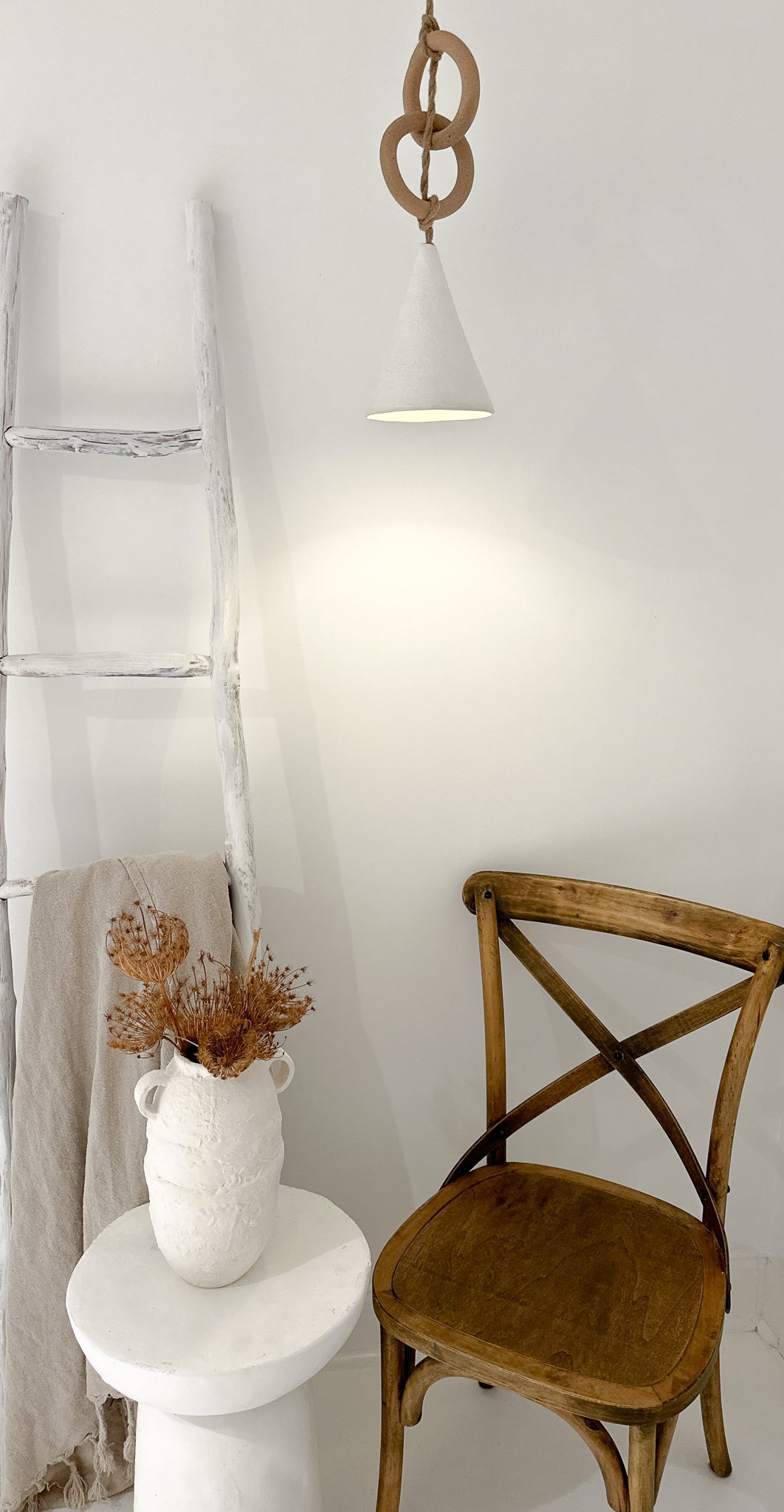 Loops pendant light hanging from a fabric cord