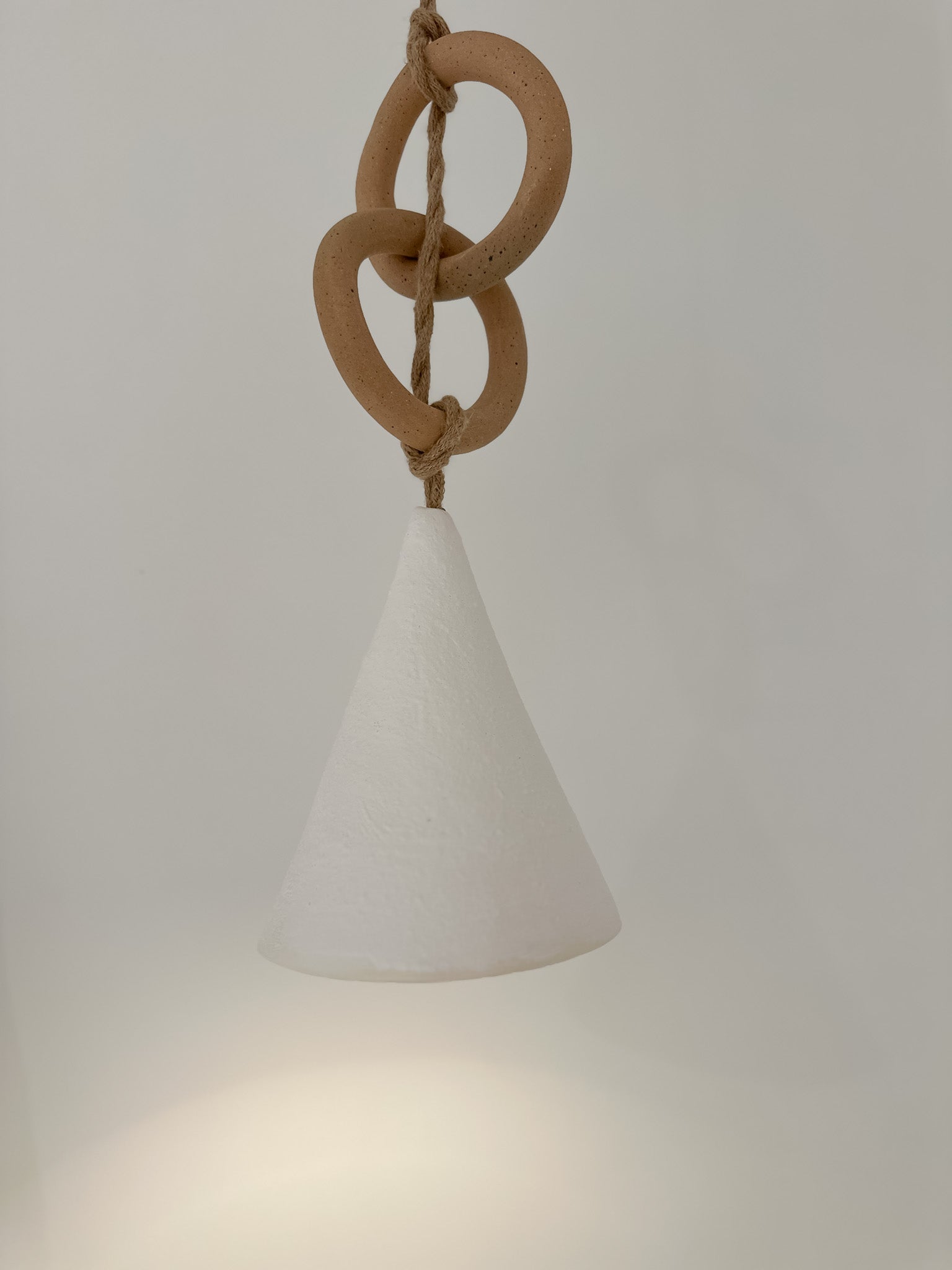 Handmade ceramic loops pendant light, close-up of the finish