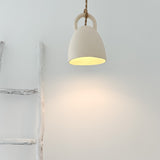 Open-bell pendant light styled over a kitchen island
