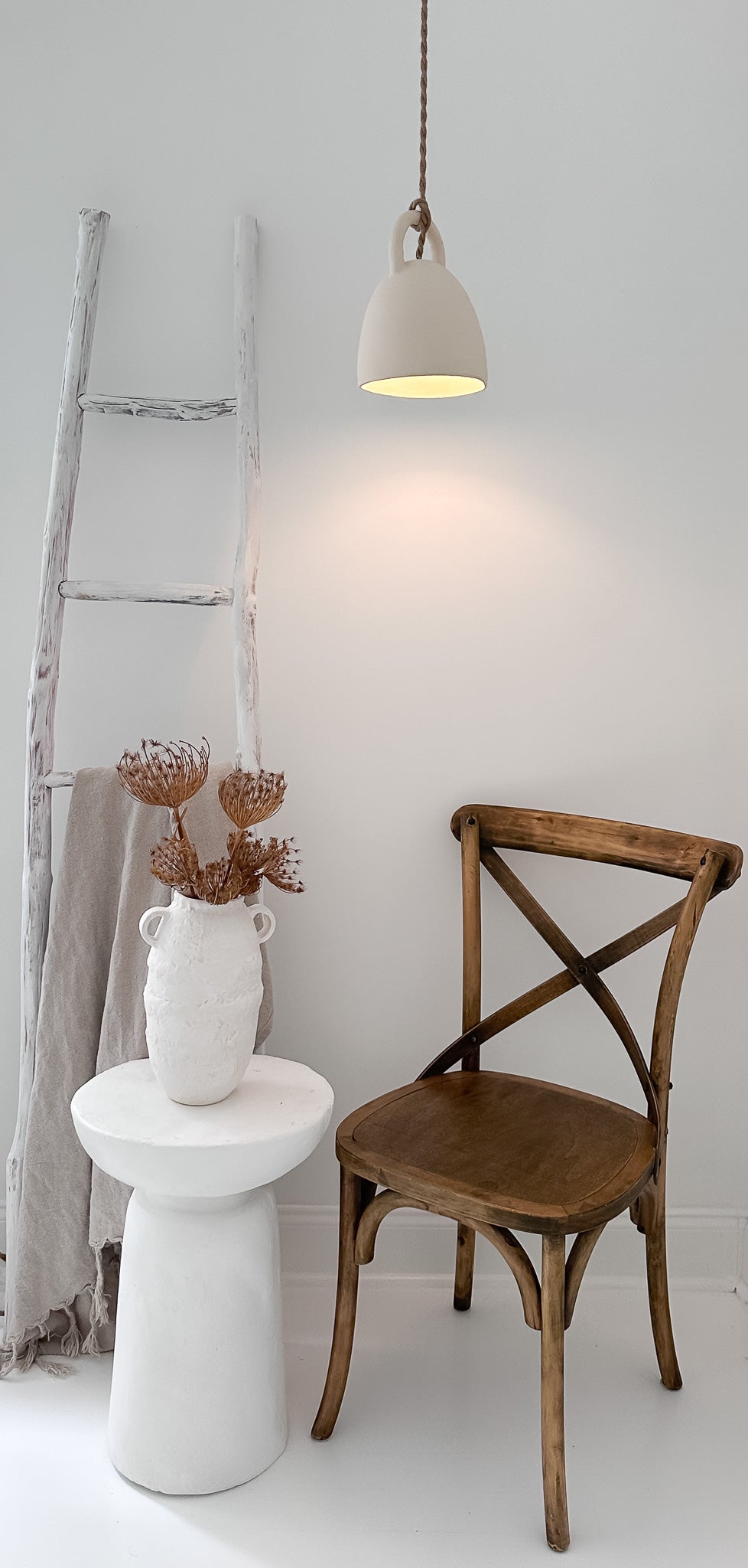 Handmade ceramic pendant light with an open bell silhouette, detail view