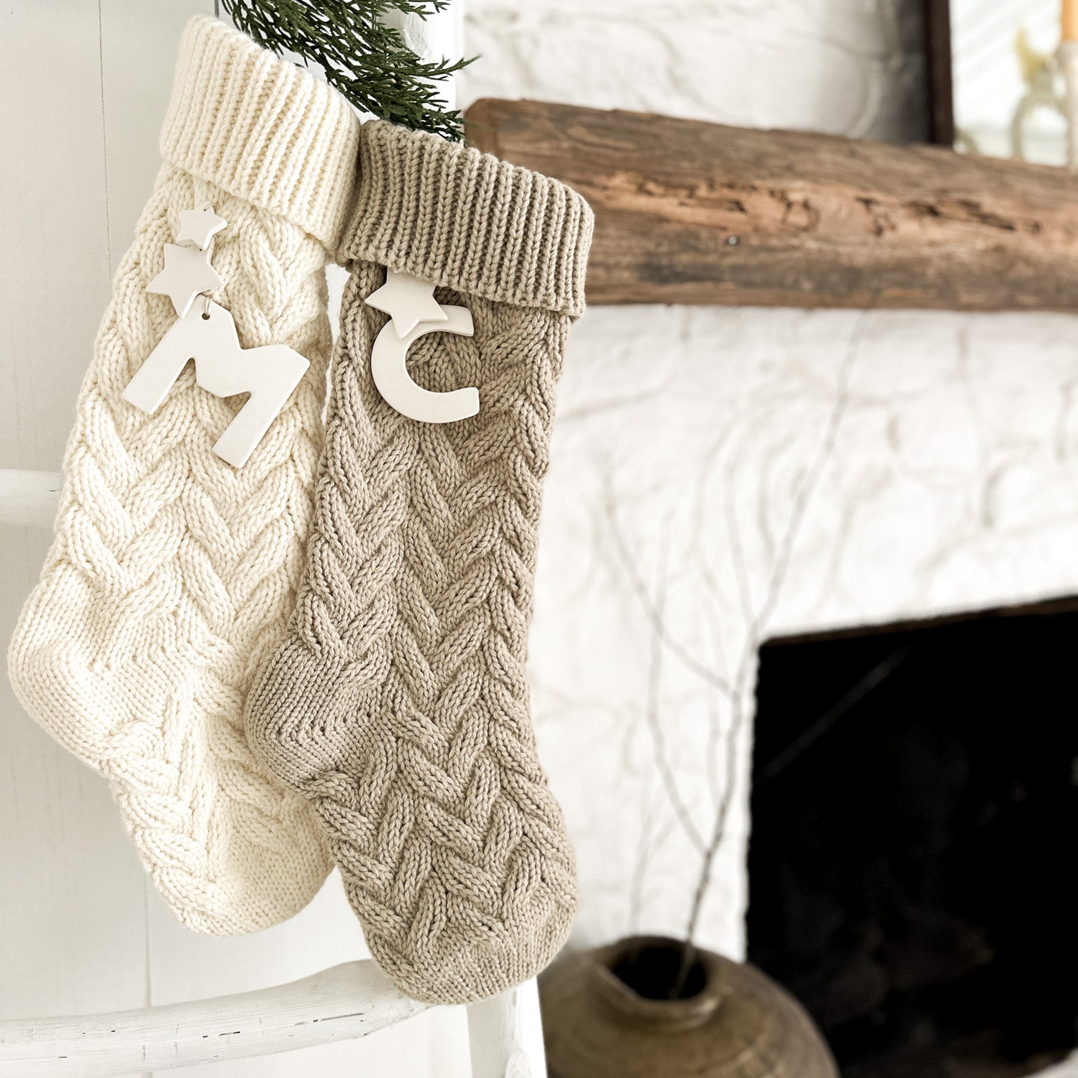 Personalized knitted holiday stocking with a ceramic initial and stars