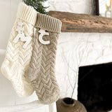 Personalized knitted holiday stocking with a ceramic initial and stars