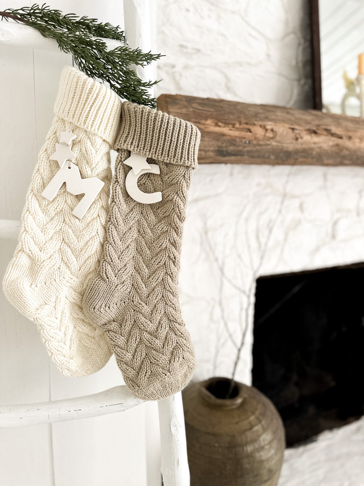 Personalized knitted holiday stocking with a ceramic initial and stars