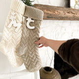 Handmade knit stocking in taupe with a personalized ceramic initial