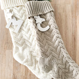 Personalized ceramic-initial stocking for a family Christmas mantel