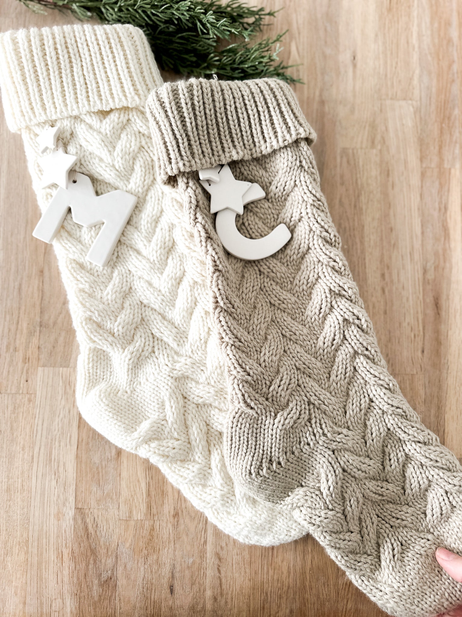 Personalized ceramic-initial stocking for a family Christmas mantel