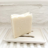 Handmade ceramic soap dish with a bar of olive oil Castile soap