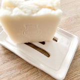 Handmade ceramic soap dish styled on a bathroom counter